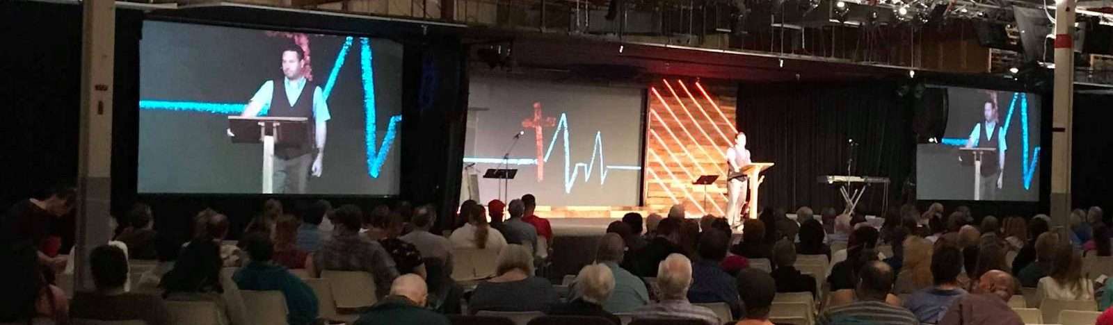 Scott LaPierre speaking to a seated conference audience